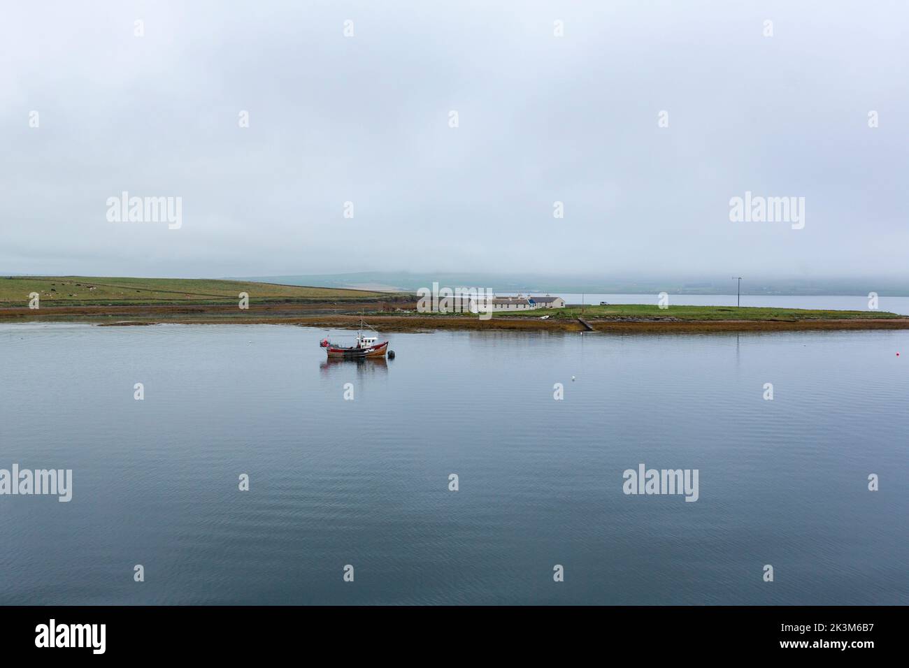 Fishing boat and the Holms of Stromness, from the NorthLink Ferries ,  Orkney, Scotland, UK Stock Photo