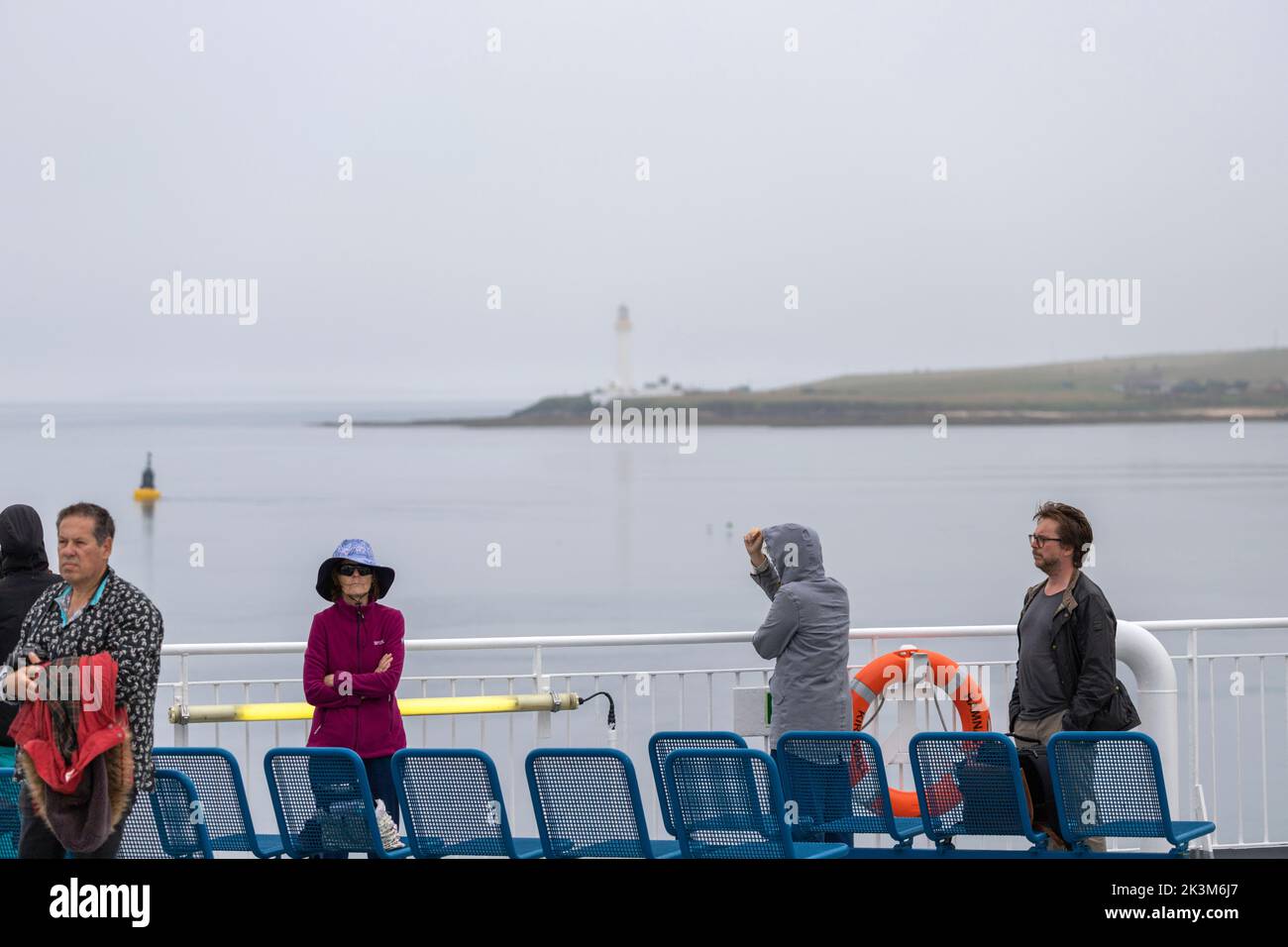 Passengers and view of Hoy High Lighthouse from the NorthLink Ferries ,  isle of Graemsay  Orkney, Scotland, UK Stock Photo
