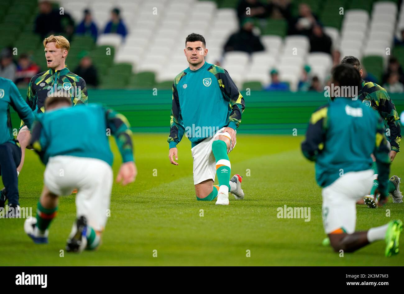 Republic of Ireland's John Egan (centre) warming up prior to kick-off before the UEFA Nations League match at the Aviva Stadium in Dublin, Ireland. Picture date: Tuesday September 27, 2022. Stock Photo