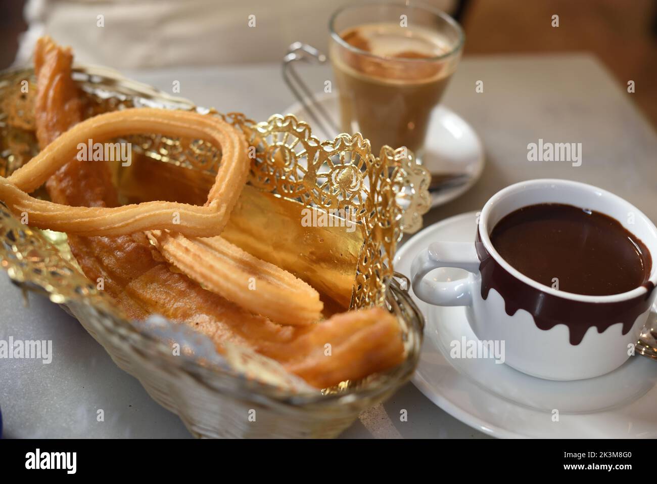 churro and hot chocolate in spanish cafe Stock Photo Alamy