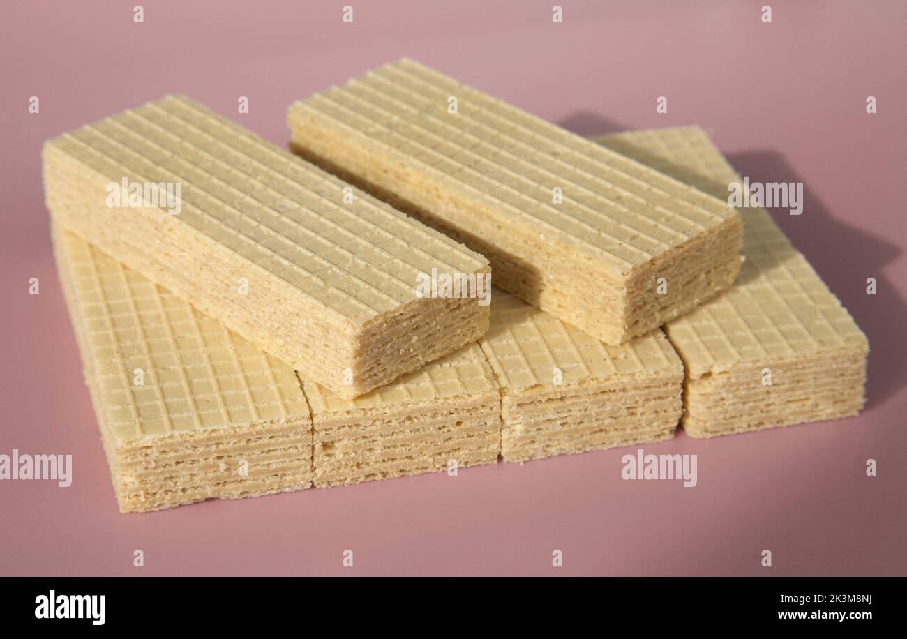 Many crispy wafers biscuit on a pink background Stock Photo Alamy