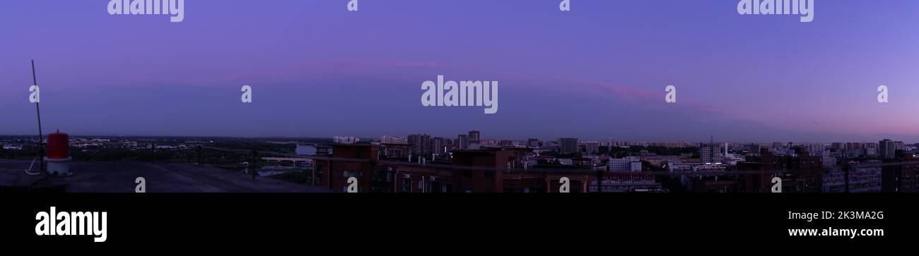 A panoramic sunset landscape with the purple sky Stock Photo - Alamy