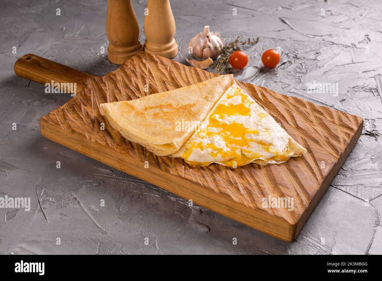 Pancake with yolk of egg and cheese crepes dish french cuisine Stock