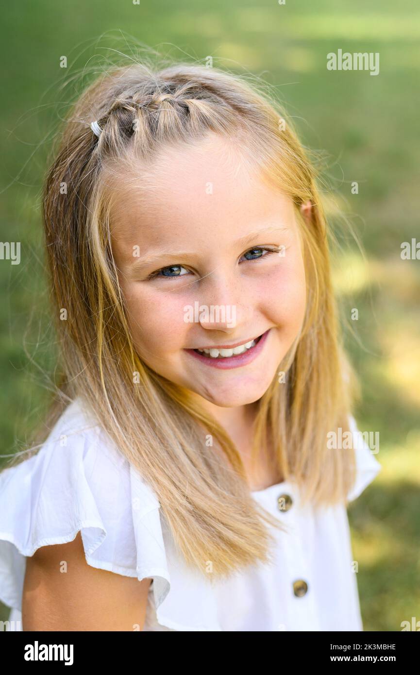 Happy smiling blond girl hi-res stock photography and images - Alamy