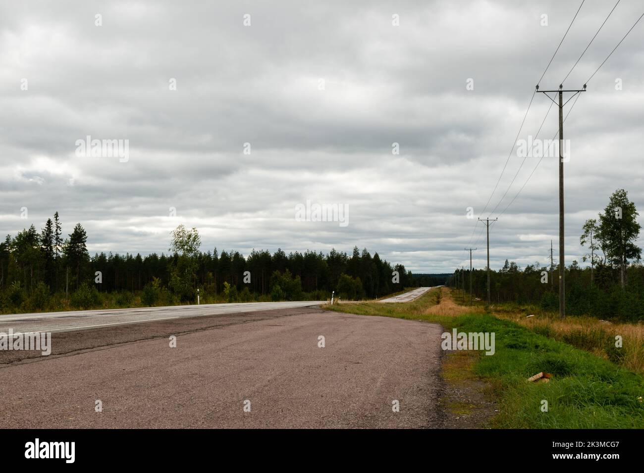 Empty Finnish country road in summer, Otanmäki, Finland Stock Photo
