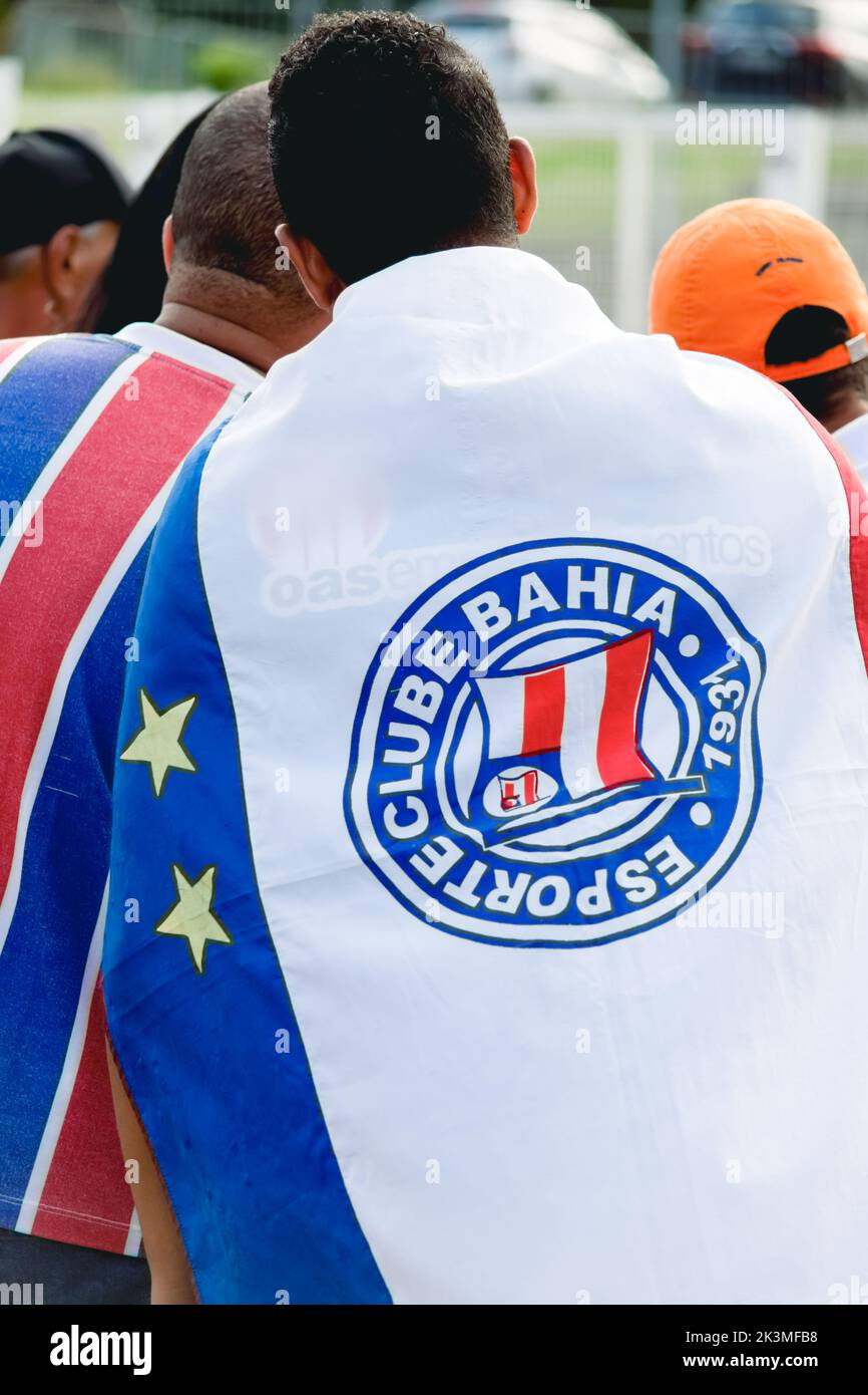 Salvador, Bahia, Brazil - April 01, 2018: Supporter of Esporte Clube Bahia football team, dressed with flag in the vicinity of Arena Fonte Nova stadiu Stock Photo
