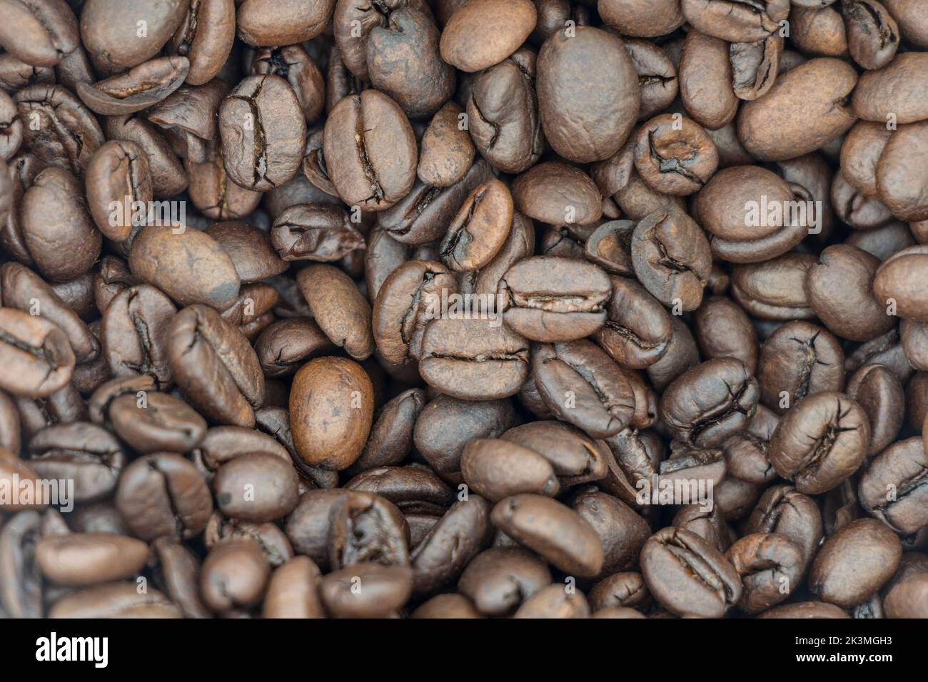 A top view of stack of dark brown roasted coffee beans Stock Photo - Alamy