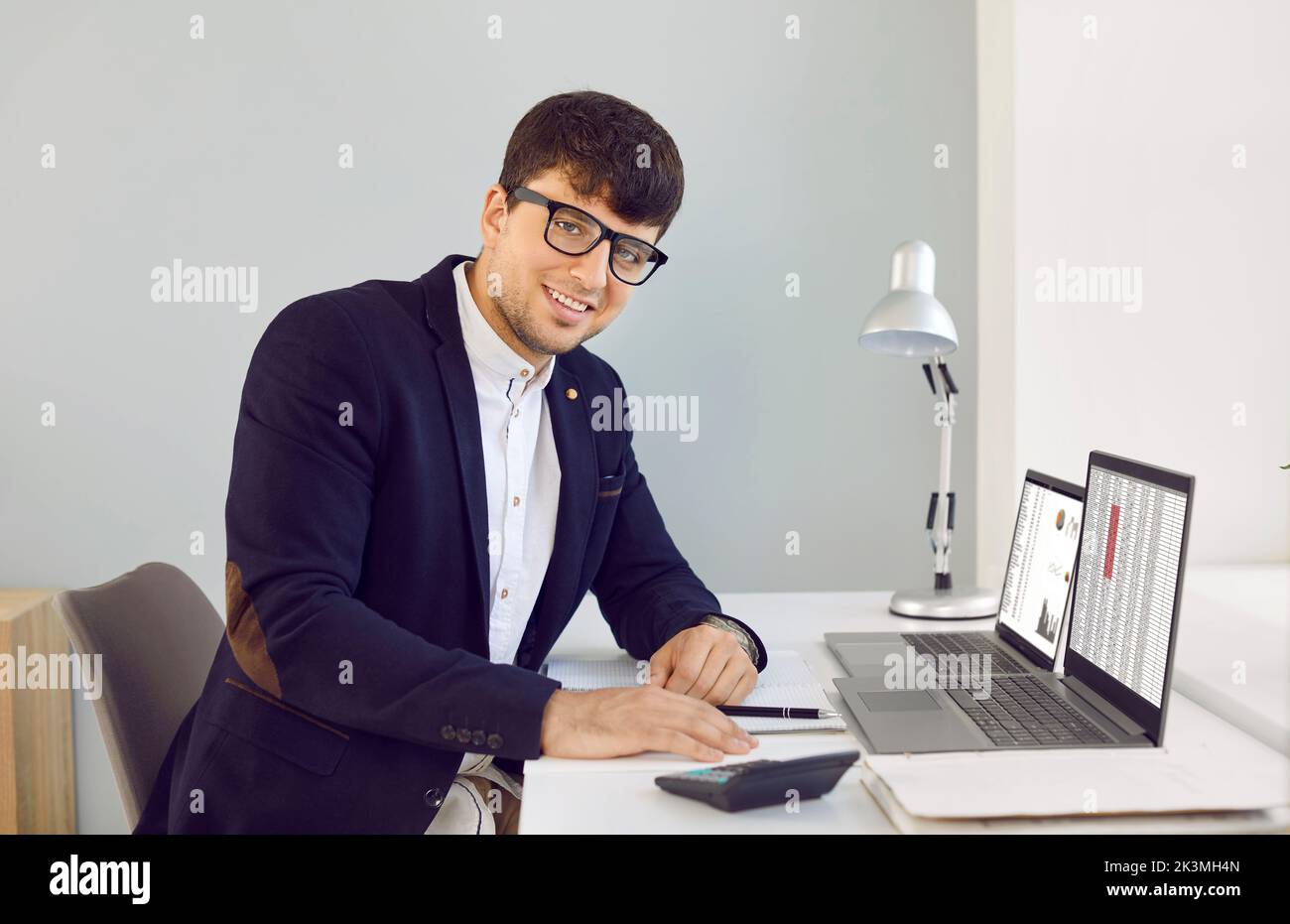 Portrait of male financial consultant who works on analysis of company accounting data. Stock Photo