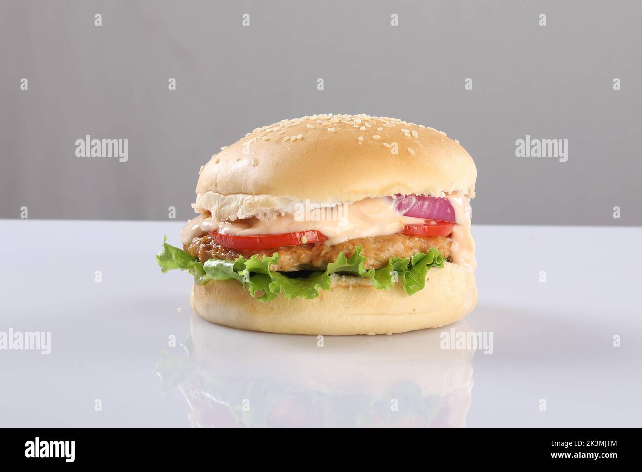 CRISPY CHEESY CHICKEN PATTY BURGER ON WHITE background Stock Photo Alamy