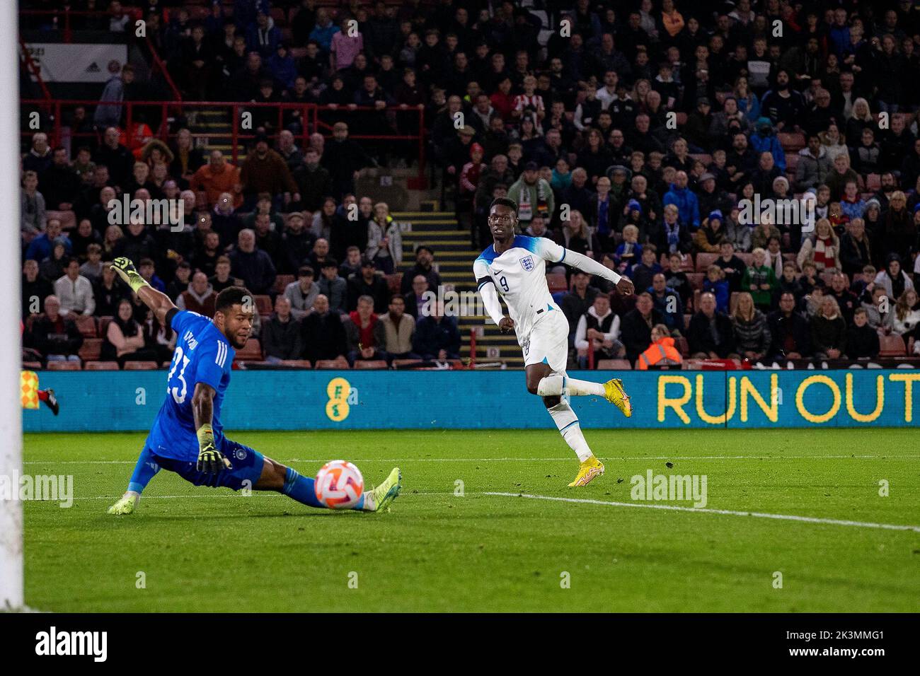 Sheffield, UK. 27th Sep, 2022. *** Noah Atubolu (23) saves from Folarin Baogun (9) of England during the International Friendly match between England U-21 and Germany U-21 at Bramall Lane, Sheffield, England on 27 September 2022. Photo by Simon Hall. Editorial use only, license required for commercial use. No use in betting, games or a single club/league/player publications. Credit: UK Sports Pics Ltd/Alamy Live News Stock Photo