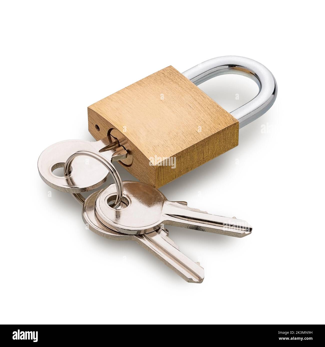 Brass padlock with keys in it isolated on white background. Deep focus Stock Photo