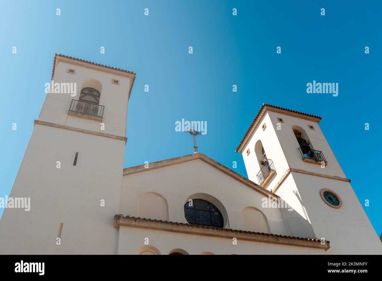 The low-angle view of Iglesia Santa Maria Magdalena under the blue sky Stock Photo