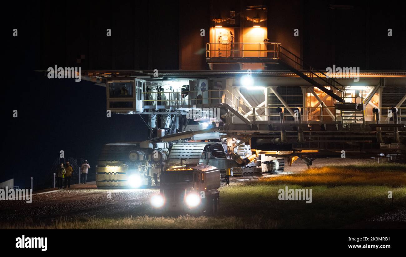 Kennedy Space Center, United States of America. 27 September, 2022. The Crawler-Transporter 2 moves the NASA Artemis Space Launch System rocket and Orion spacecraft atop the mobile launcher as it is rolled back to the Vehicle Assembly Building from Launch Pad 39B at the Kennedy Space Center, September 27, 2022, in Cape Canaveral, Florida. The SLS rocket is being returned to the Vehicle Assembly Building to protect it from approaching Hurricane Ian. Credit: Joel Kowsky/NASA/Alamy Live News Stock Photo