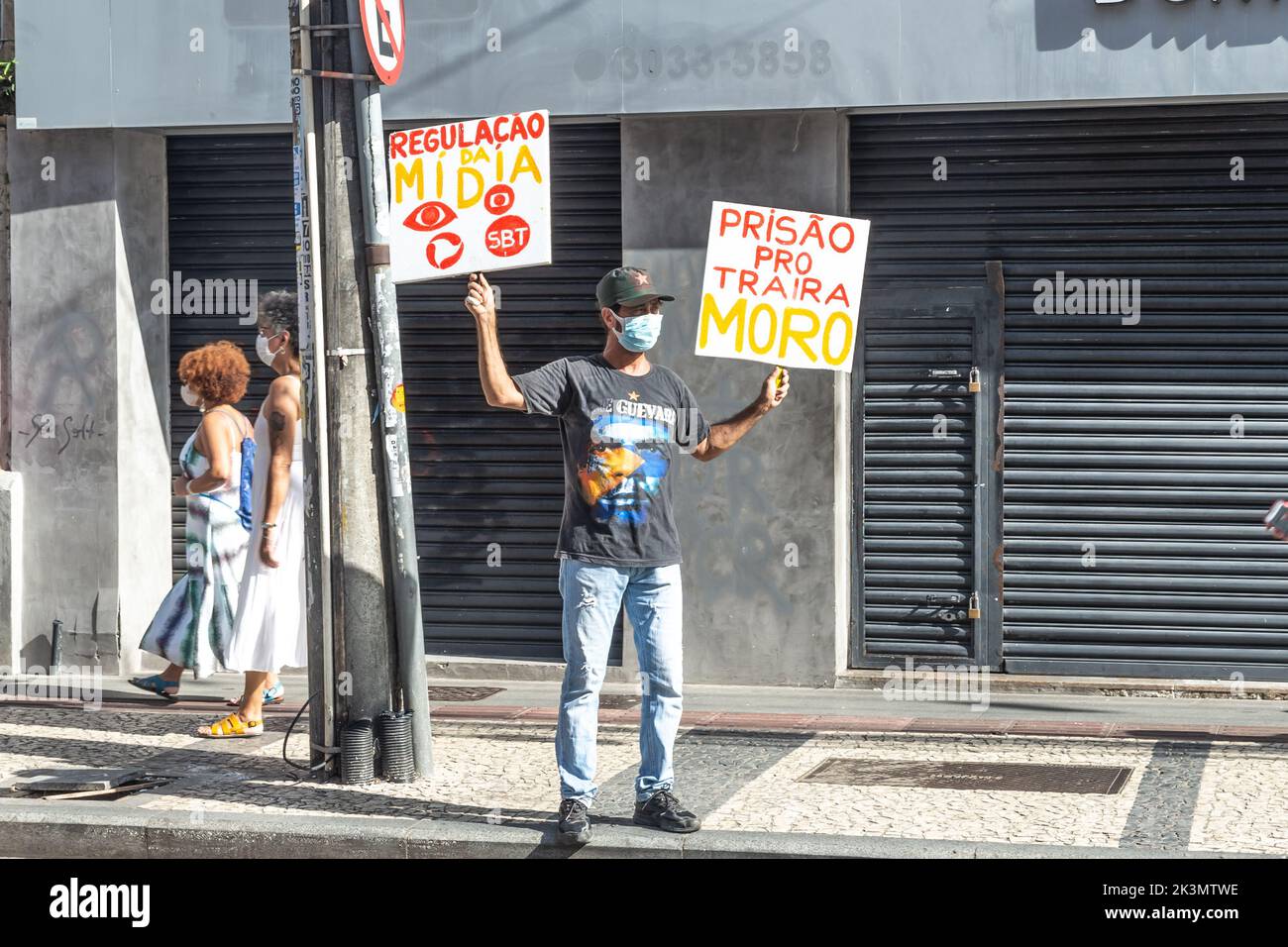 Salvador, Bahia, Brazil - November 20, 2021: Brazilians protest carrying posters against the government of President Jair Bolsonaro in the city of Sal Stock Photo