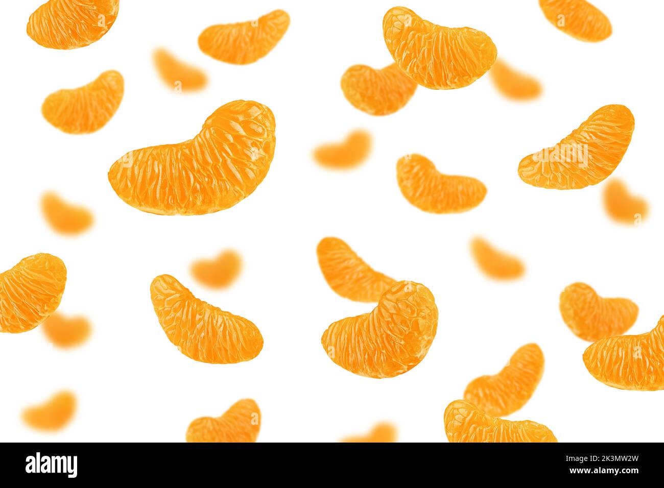 Falling Mandarin lobule isolated on white background, selective focus Stock Photo