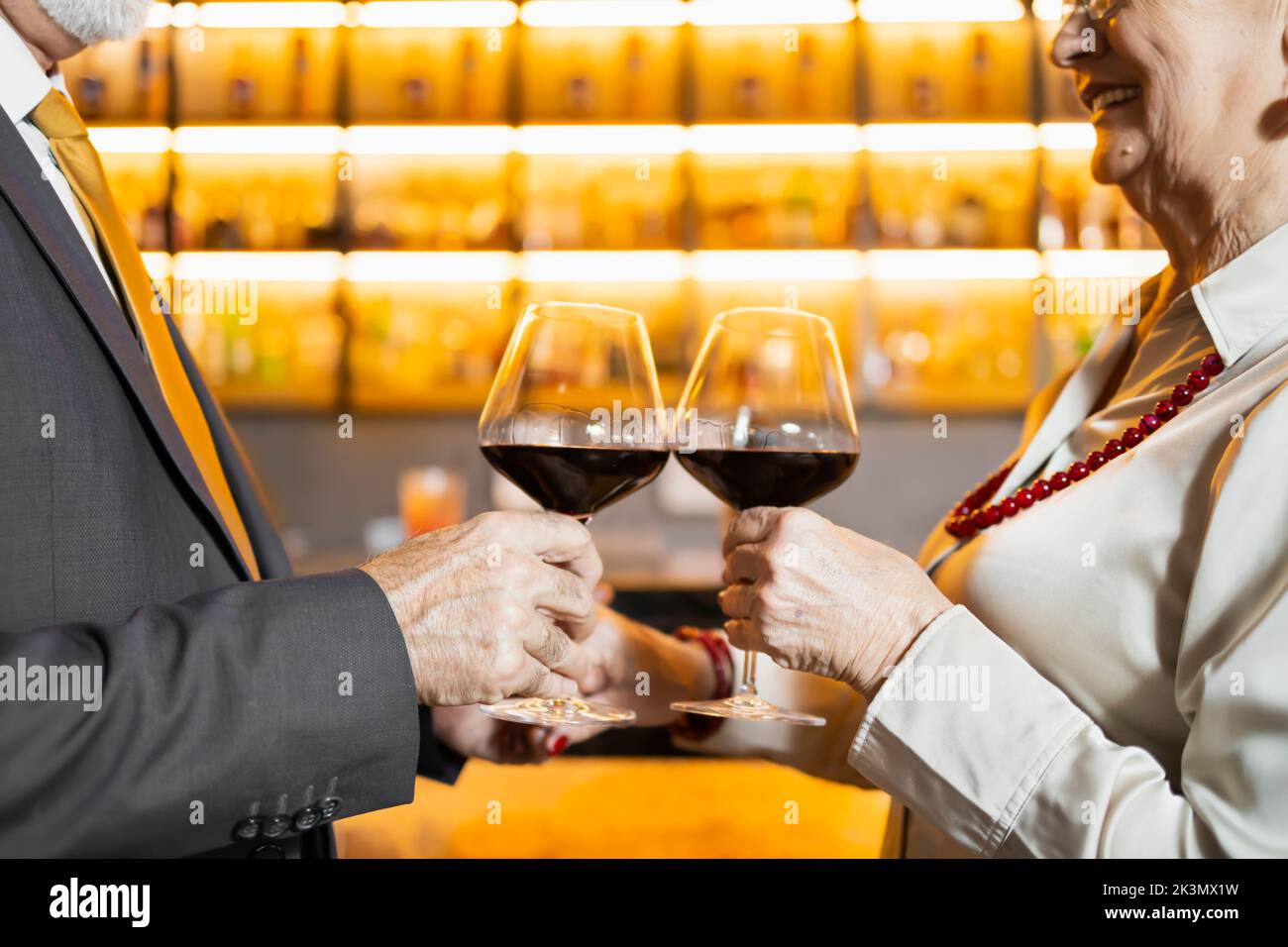 Two elderly people having a toast Stock Photo