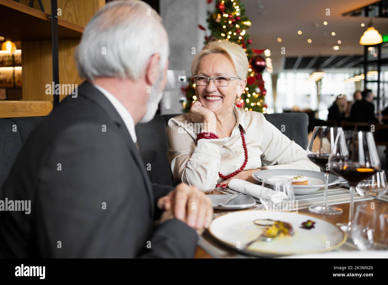 Family of two having a Christmas dinner at the bar Stock Photo