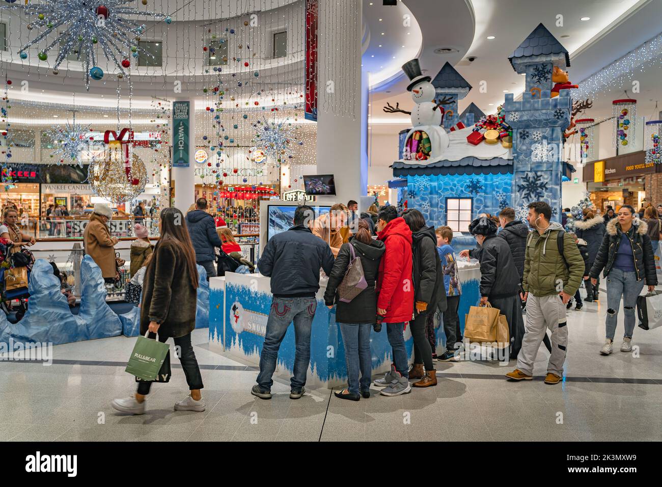 Dublin, November 2019 People, families queuing to visit Santa Claus grotto or castle in Jervis Shopping Centre Stock Photo