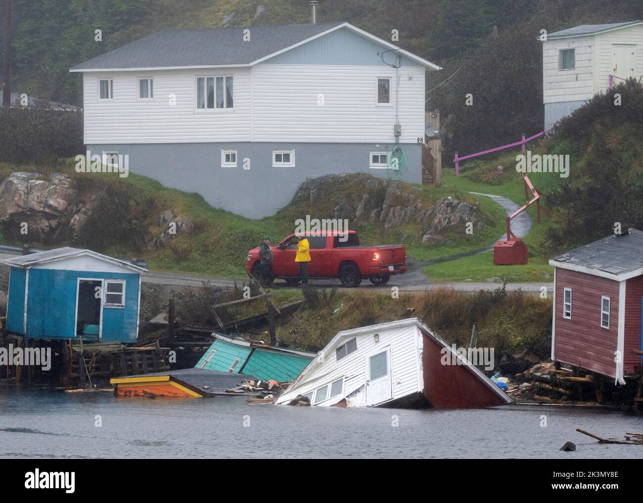 Canada, September 27, 2022, Buildings sit in the water along the shore
