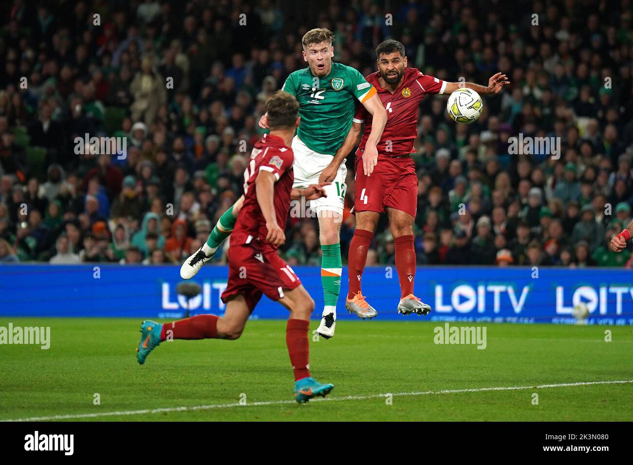 Republic of Ireland's Nathan Collins (centre) heads towards goal during the UEFA Nations League match at the Aviva Stadium in Dublin, Ireland. Picture date: Tuesday September 27, 2022. Stock Photo