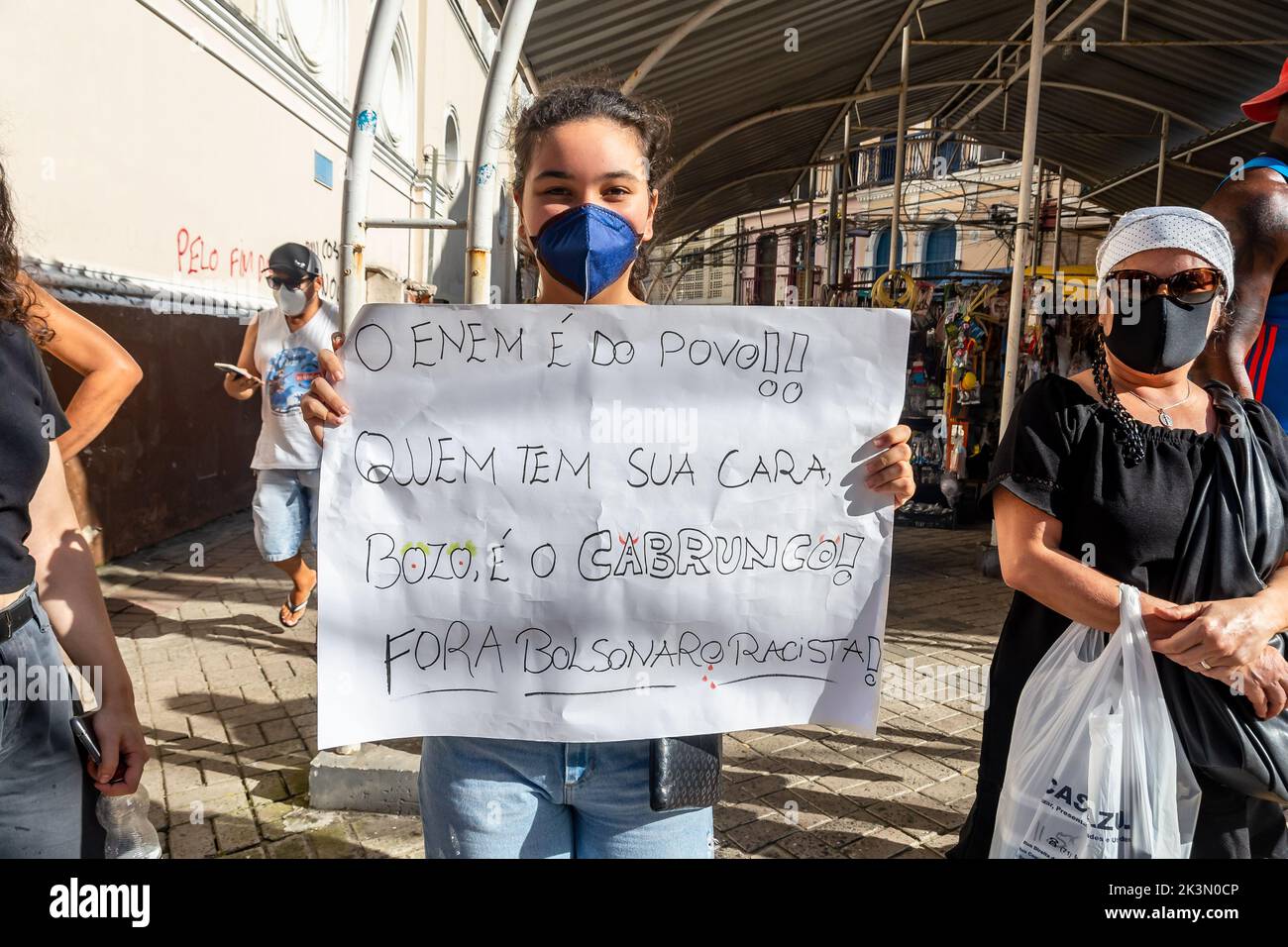 Salvador, Bahia, Brazil - November 20, 2021: Brazilians protest carrying posters against the government of President Jair Bolsonaro in the city of Sal Stock Photo