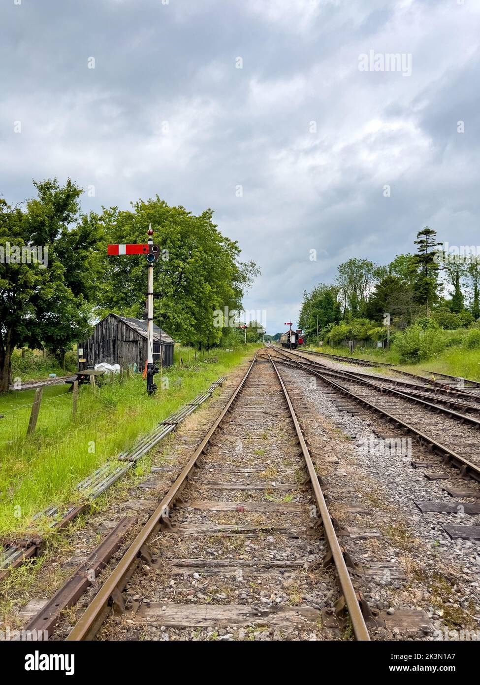 Railroad tracks passing through the countryside Stock Photo
