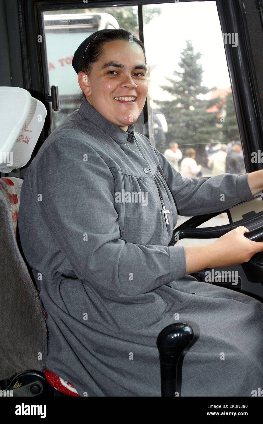 Poland, Polen, Polska, Portrait of a middle-aged nun; Porträt einer Nonne mittleren Alters; the nun is driving the bus, Die Nonne fährt den Bus Stock Photo