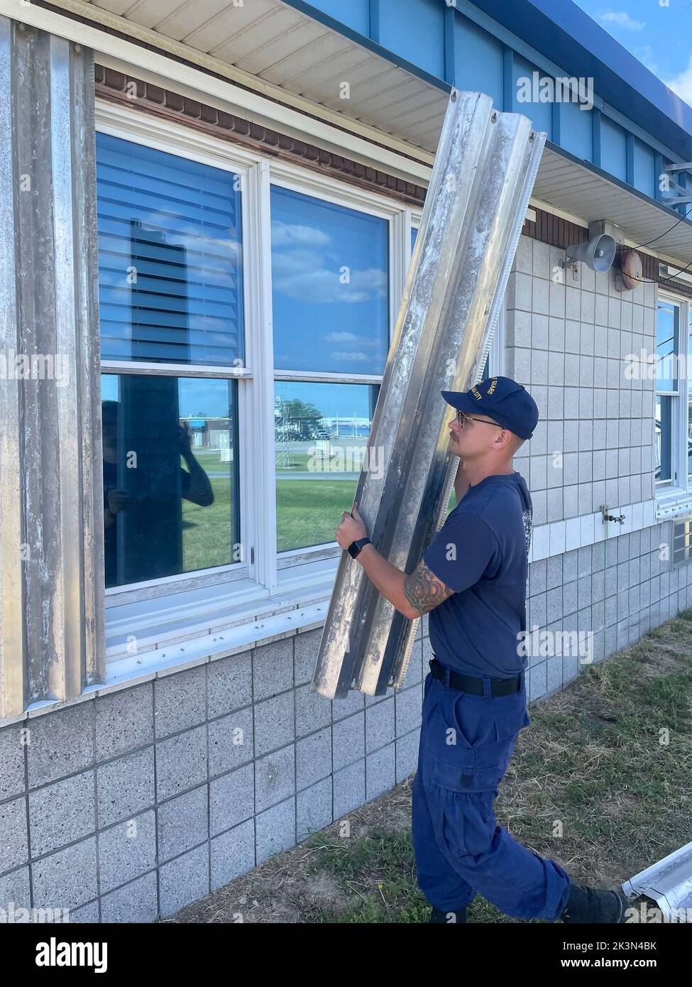 Panama City, United States. 24th Sep, 2022. Coast Guard Station Panama City personnel cover windows with hurricane shutters as they prepare for a possible strike by Hurricane Ian as it heads to the west coast of Florida as a Category 4 catastrophic storm, September 25, 2022 in Tallahassee, Florida. Credit: Robert Kaufmann/US Coast Guard/Alamy Live News Stock Photo