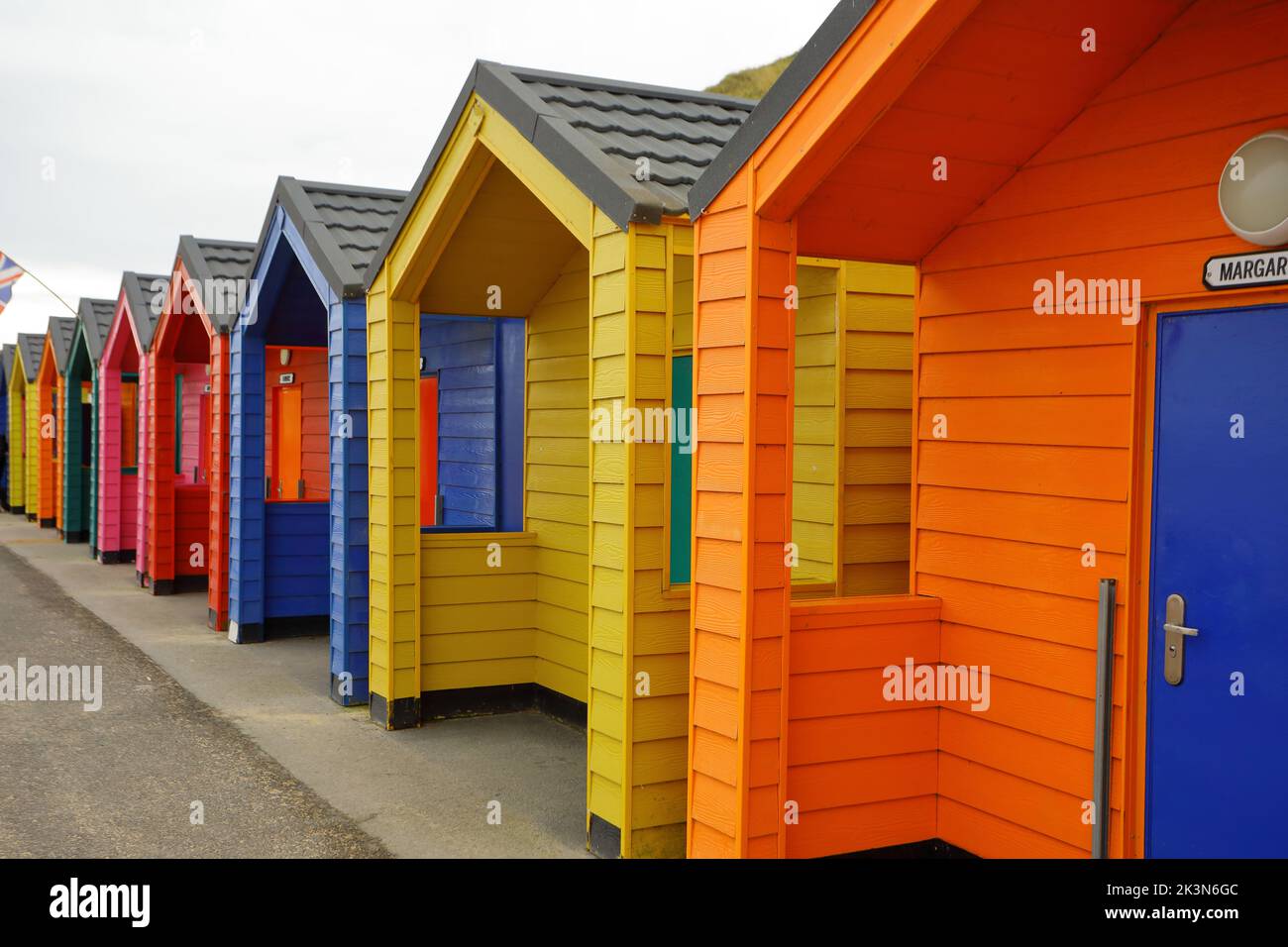 A row of bright colourful beach huts at SaltburnbytheSea Stock Photo