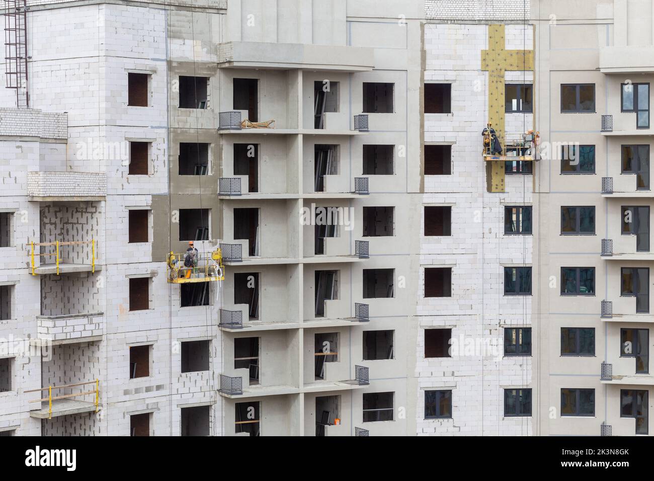 The process of insulating external walls in a multi-storey building ...