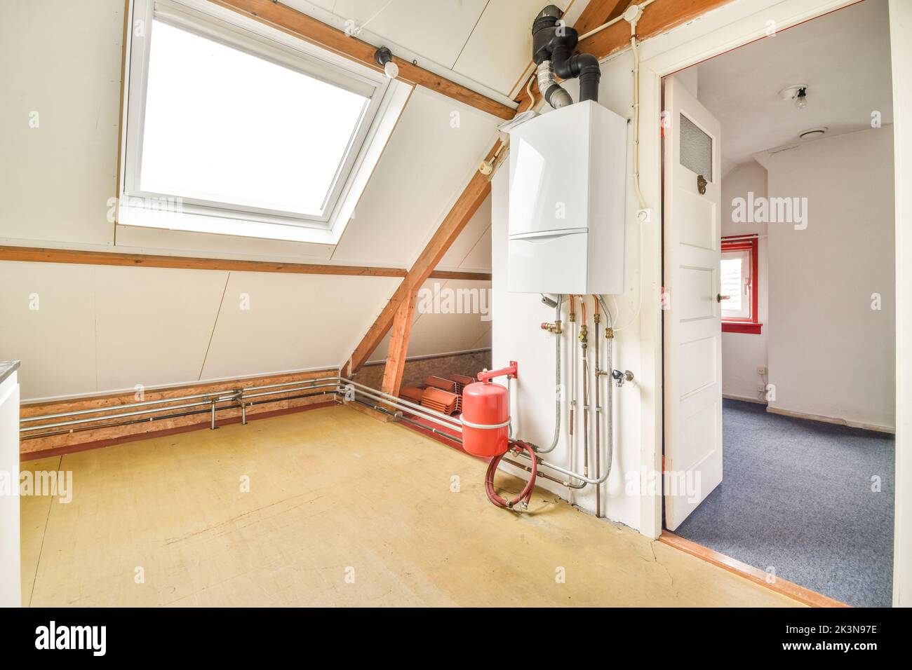 Boiler room of an apartment building with pipes and metering devices. A