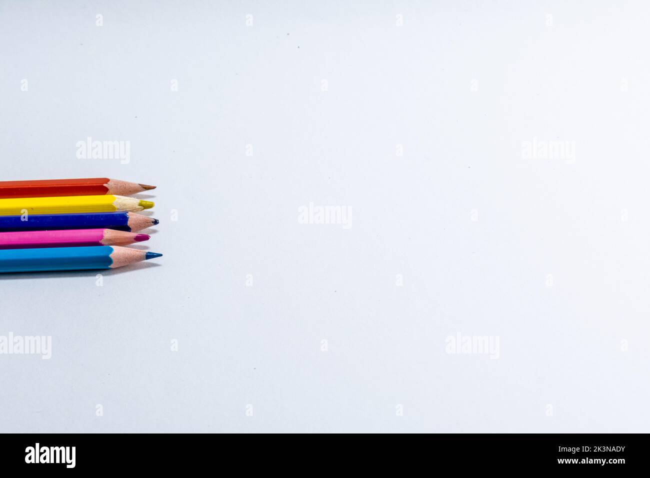 Colorful wooden pencils isolated on white background. close up Stock Photo