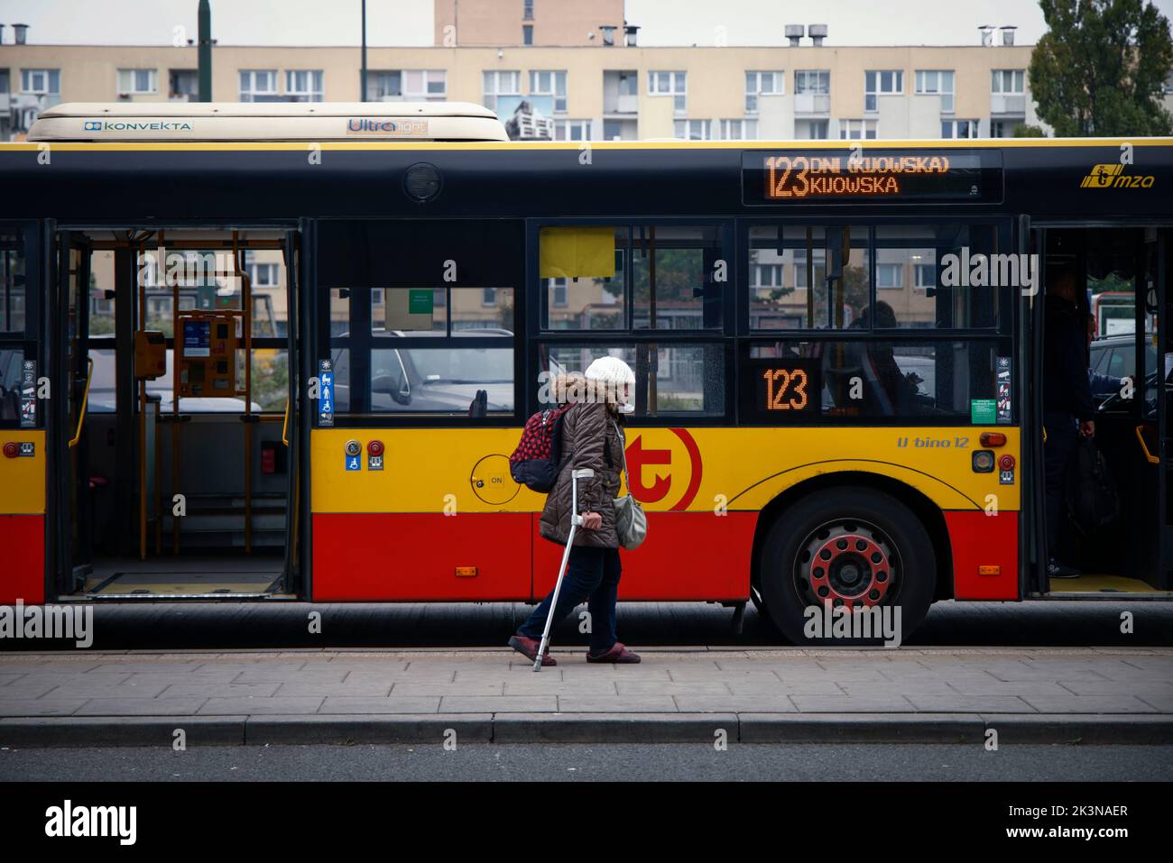 An elderly woman with crutches walks past a bus at the Warsaw East railway station in Warsaw, Poland on 27 September, 2022. Poland's agein population has sharply decreased Poland's agein population has sharply decreased in just the last decade, declining by nearly Poland's agein population has sharply decreased in just the last decade, declining by nearly half a million. The country's population is also ageing Poland's agein population has sharply decreased in just the last decade, declining by nearly half a million. The country's population is also ageing with every fifth citizen being 65 yea Stock Photo