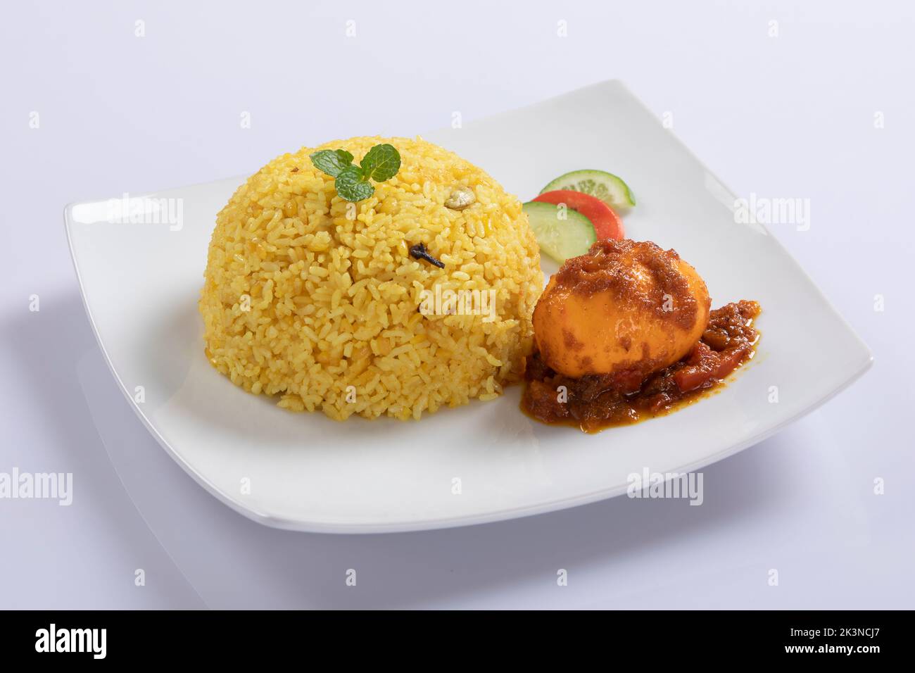 Top view of Bengali dish khichdi or khichuri made from a combination of lentils and rice along with Indian spices. Top view. Egg khichuri. Chicken Khi Stock Photo