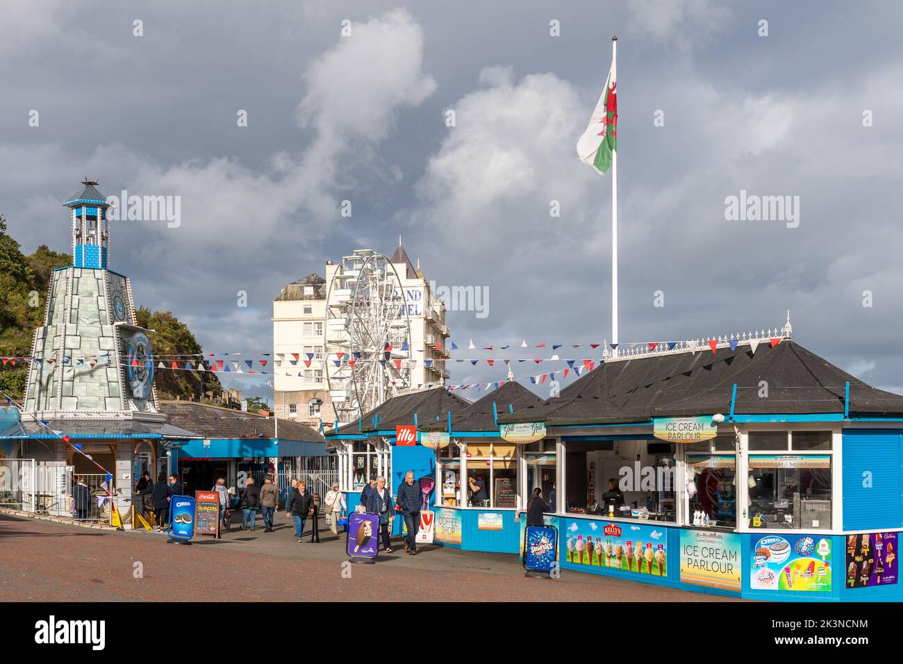 Entrance to the pier with the Grand Hotel visible in Llandudno, North Wales, Ireland. Stock Photo