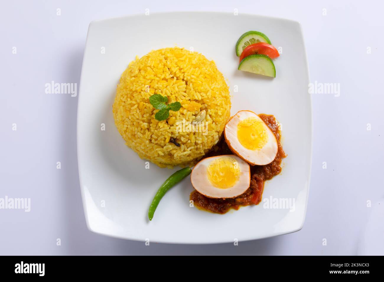 Top view of Bengali dish khichdi or khichuri made from a combination of lentils and rice along with Indian spices. Top view. Egg khichuri. Chicken Khi Stock Photo