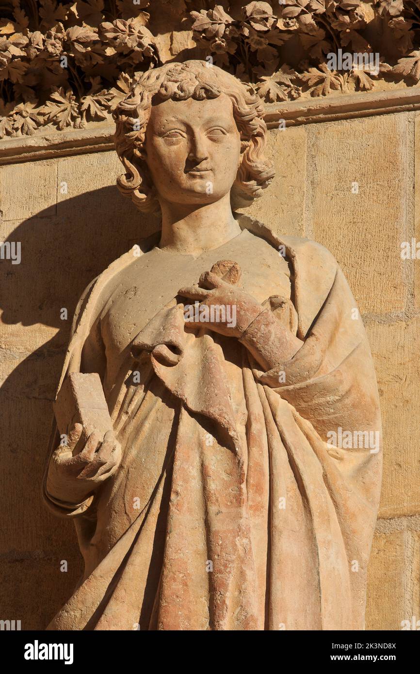 Statue of John the Apostle at the North portal of the West facade of Reims Cathedral (a UNESCO World Heritage Site) in Reims (Marne), France Stock Photo
