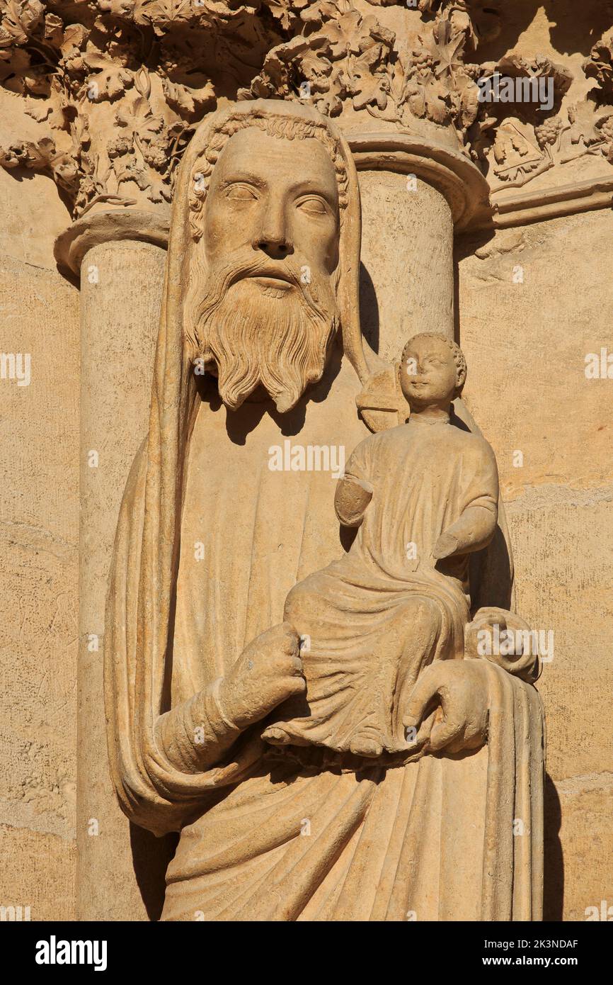 Statue of Saint Simeon (St. Simon) holding baby Jesus on the West facade of Reims Cathedral (a UNESCO World Heritage Site) in Reims (Marne), France Stock Photo