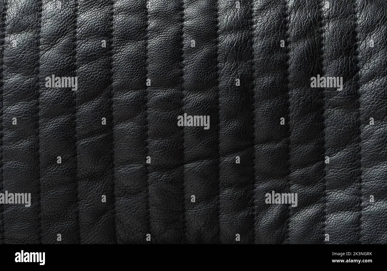 Black leather surface with vertical stiches line close up view Stock Photo