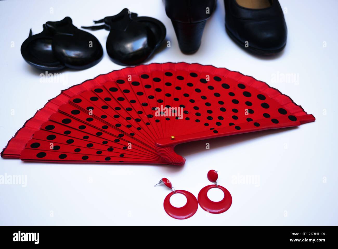 objects used in flamenco fan, castanets, high heel shoes and earrings on a white background Stock Photo
