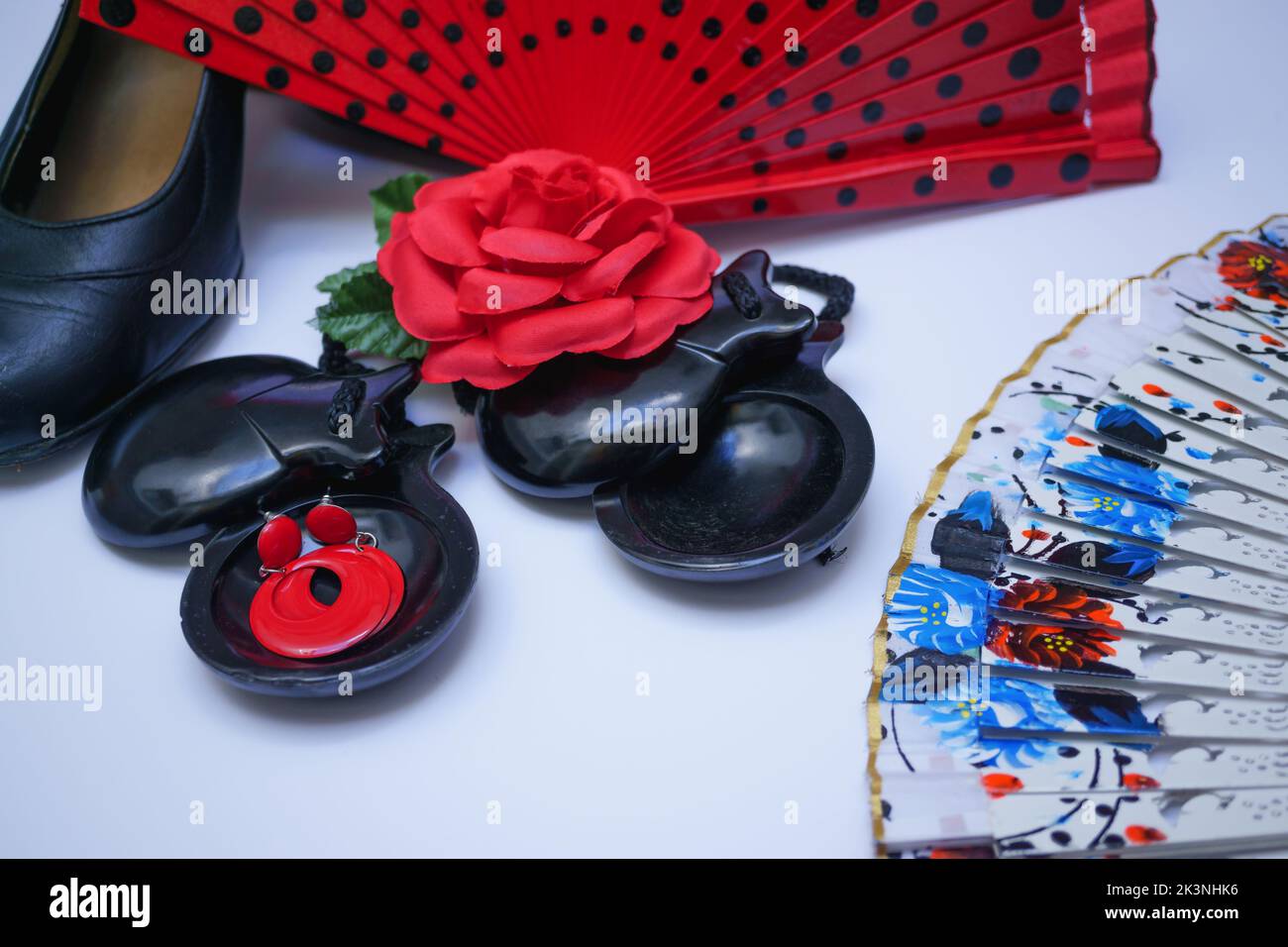 objects used in flamenco fan, castanets, high heel shoes and earrings on a white background Stock Photo