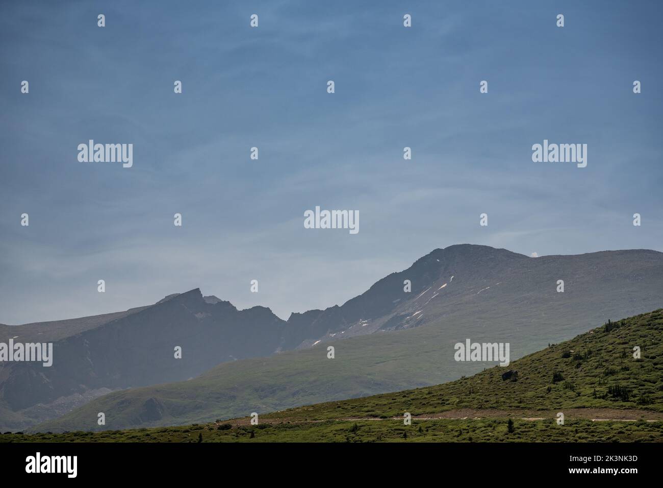Thin Clouds Highlight The Sky Over Bierstadt Mountain in Rocky Mountain National Park Stock Photo