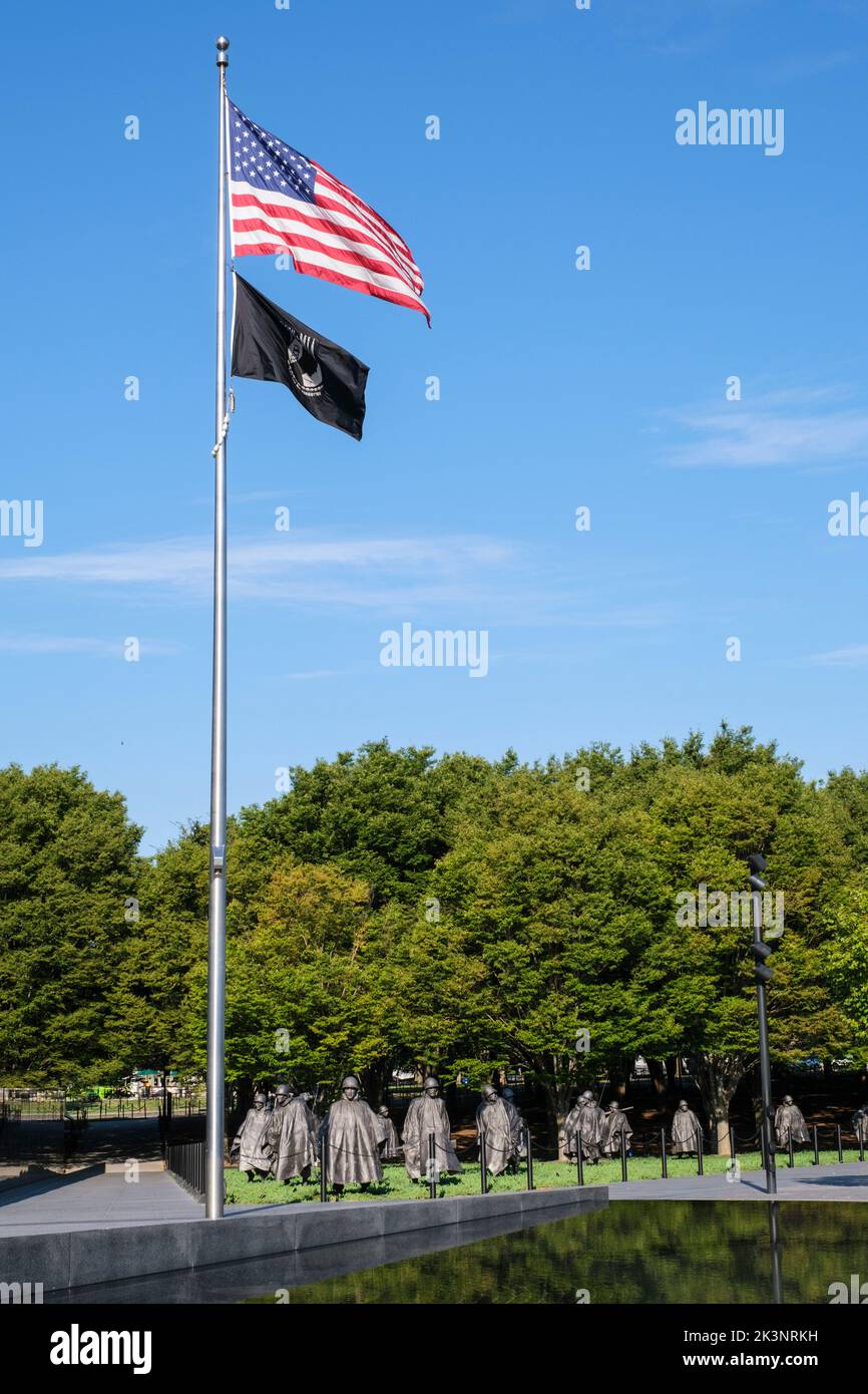 Korean War Memorial, Flag for the Prisoners of War-Missing in Action Flies below the American Flag. Sculptures by Frank Gaylord in the background. Was Stock Photo