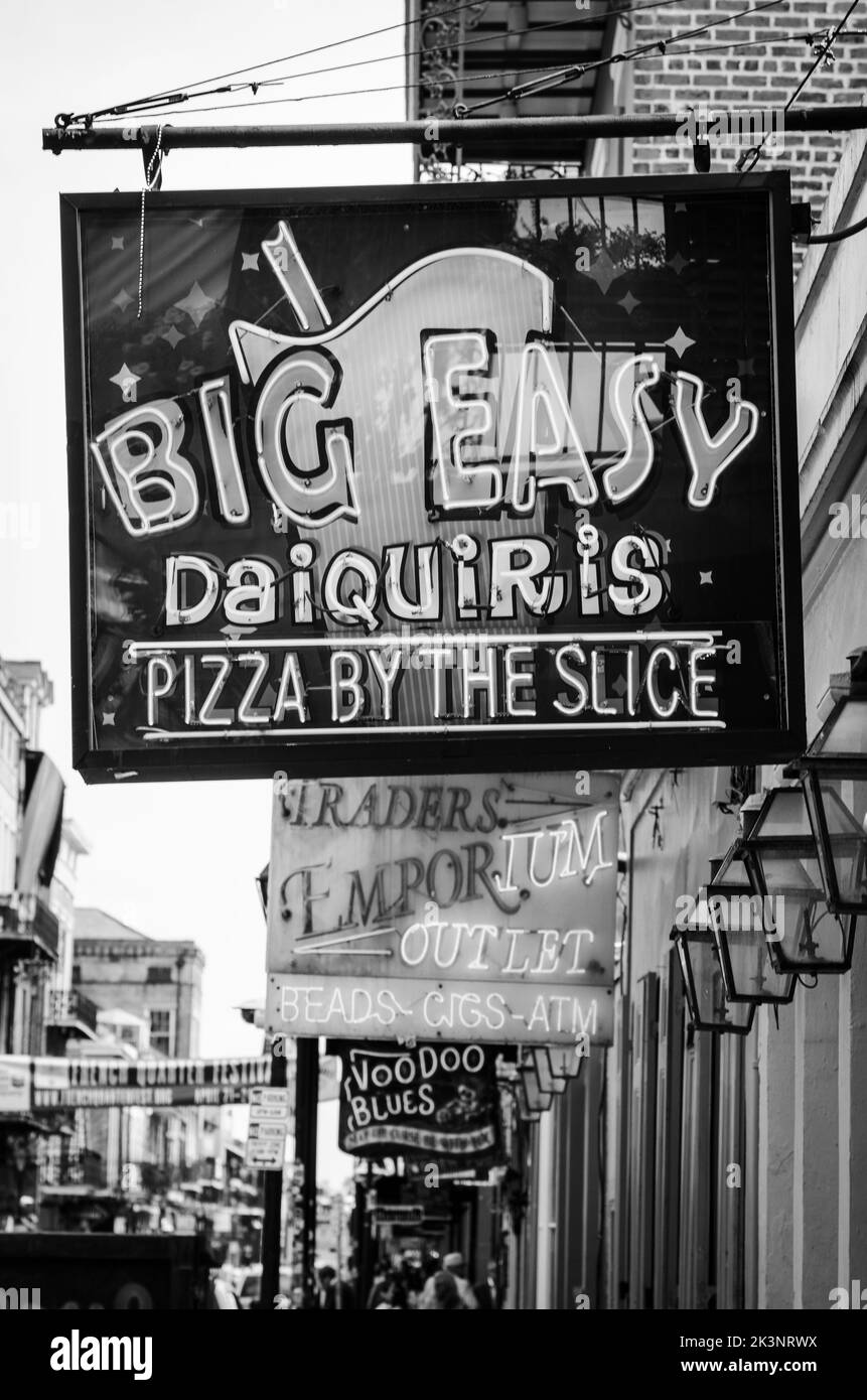 Neon sign outside store fronts in the Bourbon Street area of New Orleans, Louisiana, USA Stock Photo