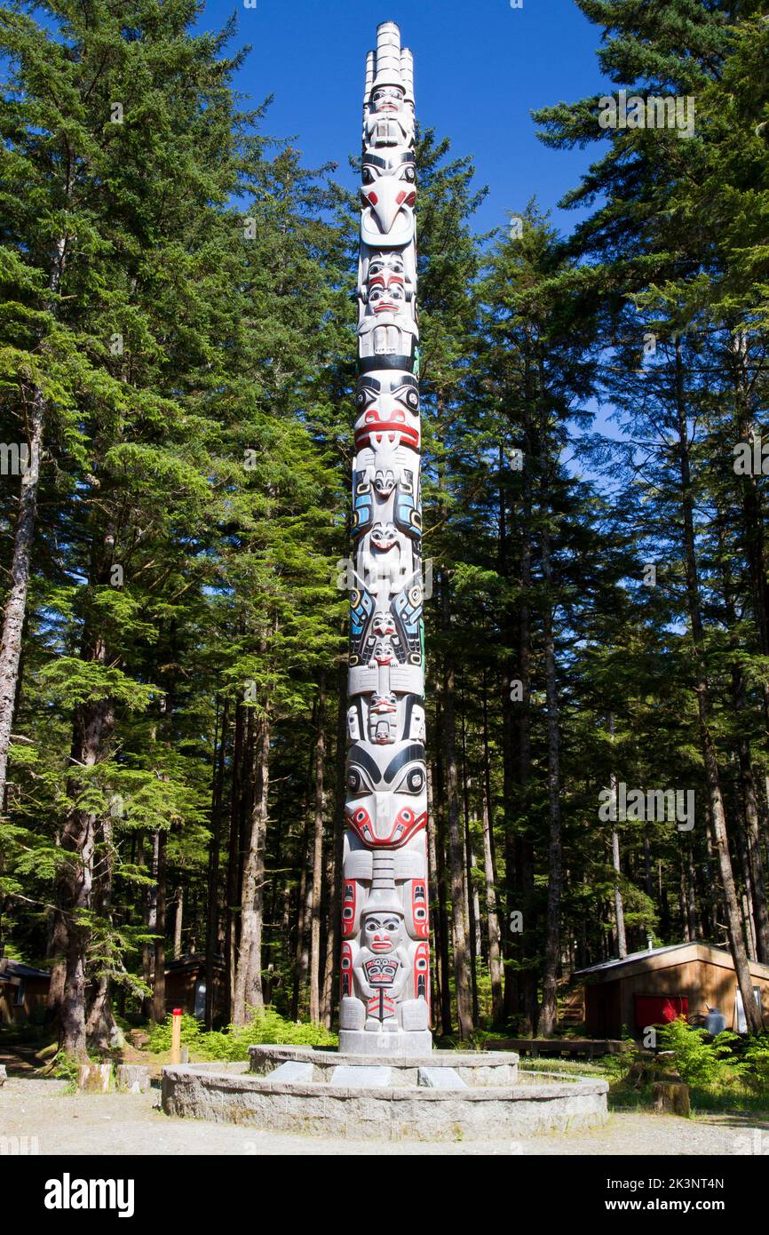 The sixty-two feet red cedar House Pole at the camp-ground at the end of Towhill Road by the Hiellen Longhouse Village, Haida Gwaii, BC, Canada Stock Photo