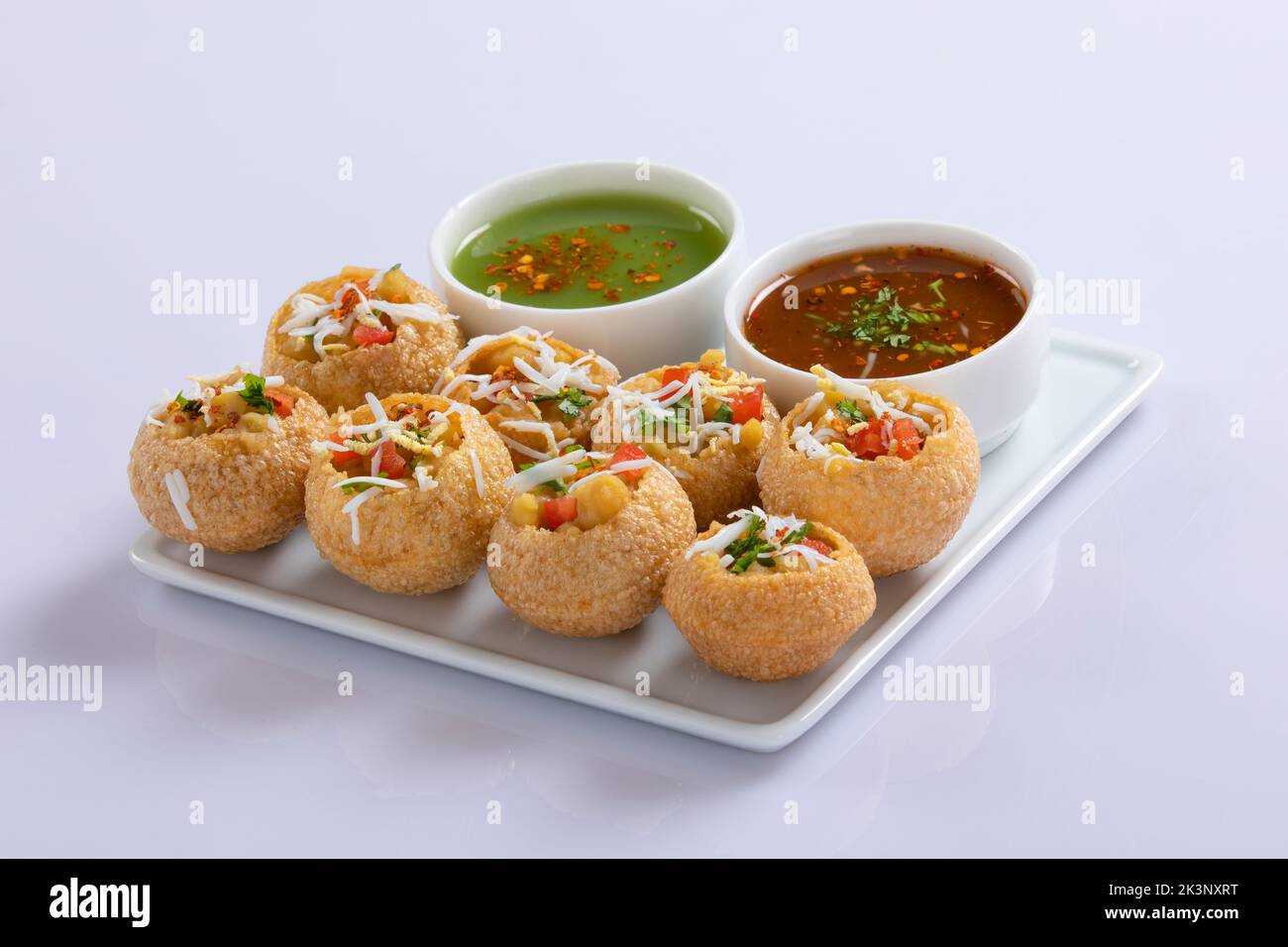 Panipuri or fuchka fhuchka or gupchup or golgappa or Pani ke Patake is a type of snack that originated in the Indian subcontinent Stock Photo