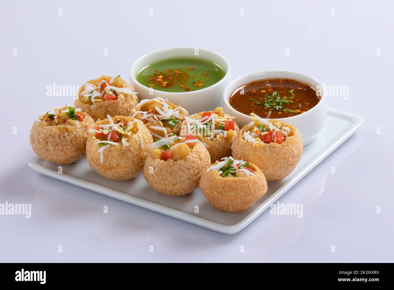 Panipuri or fuchka fhuchka or gupchup or golgappa or Pani ke Patake is a type of snack that originated in the Indian subcontinent Stock Photo