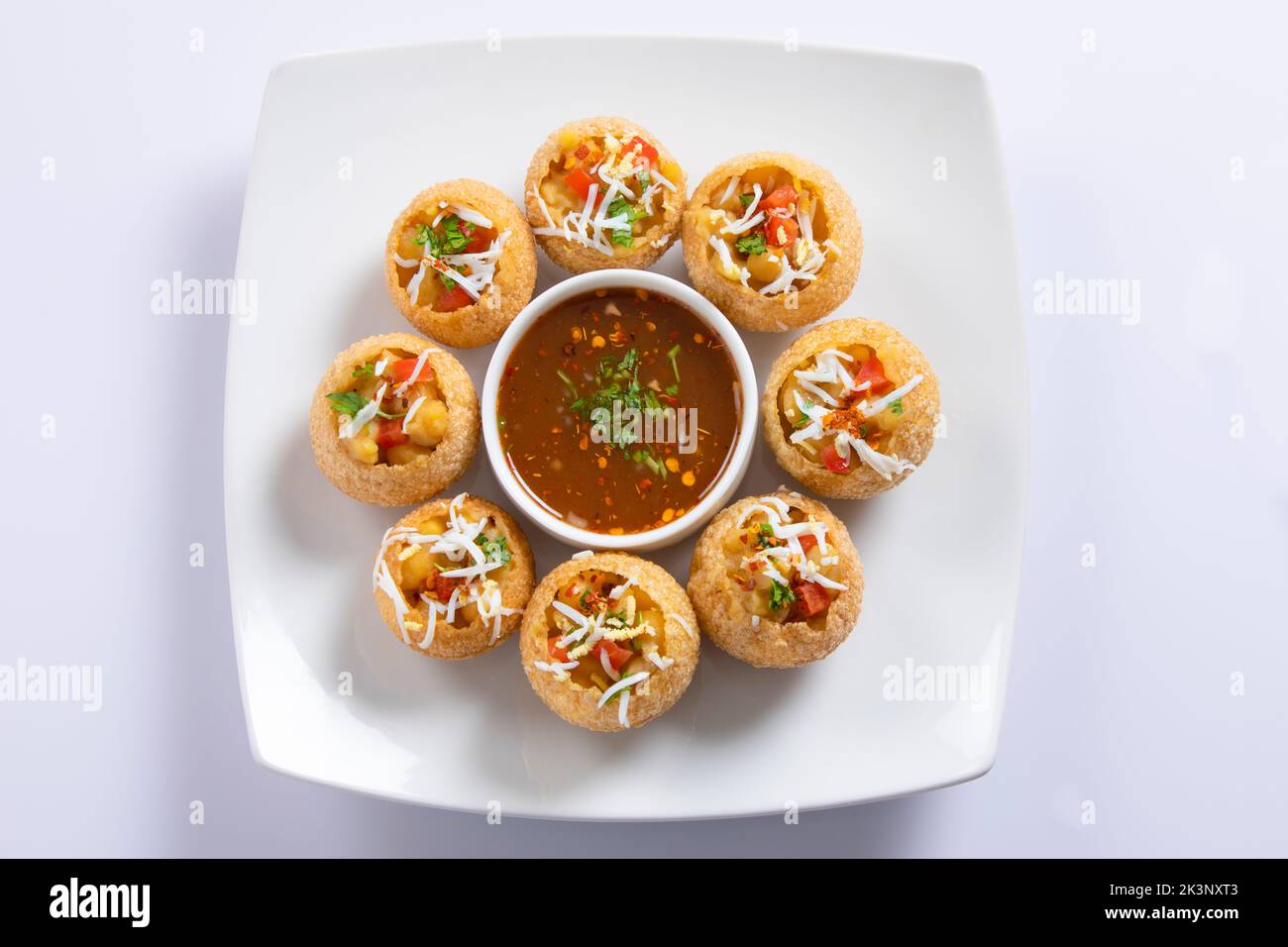 Panipuri or fuchka fhuchka or gupchup or golgappa or Pani ke Patake is a type of snack that originated in the Indian subcontinent Stock Photo