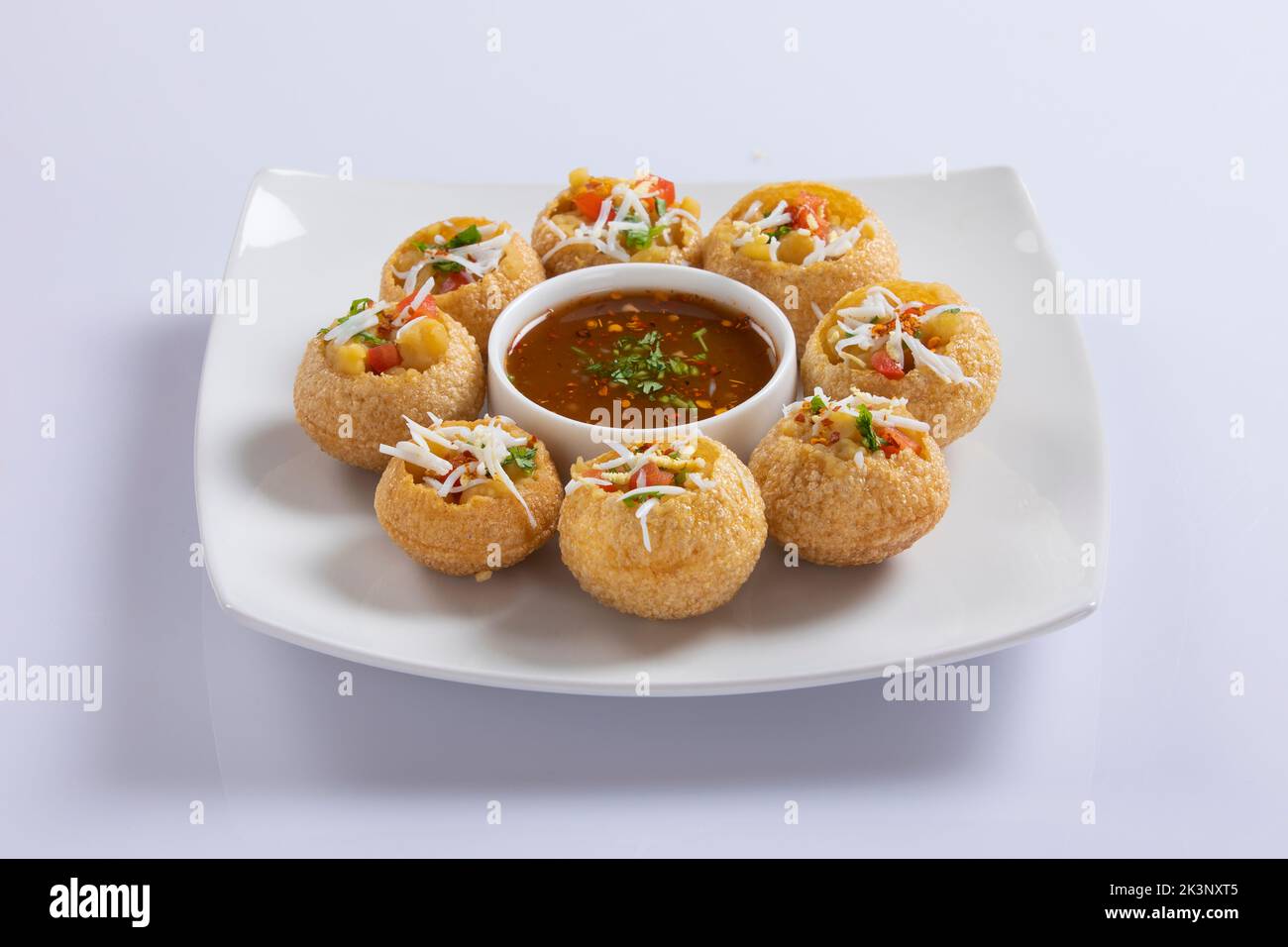 Panipuri or fuchka fhuchka or gupchup or golgappa or Pani ke Patake is a type of snack that originated in the Indian subcontinent Stock Photo