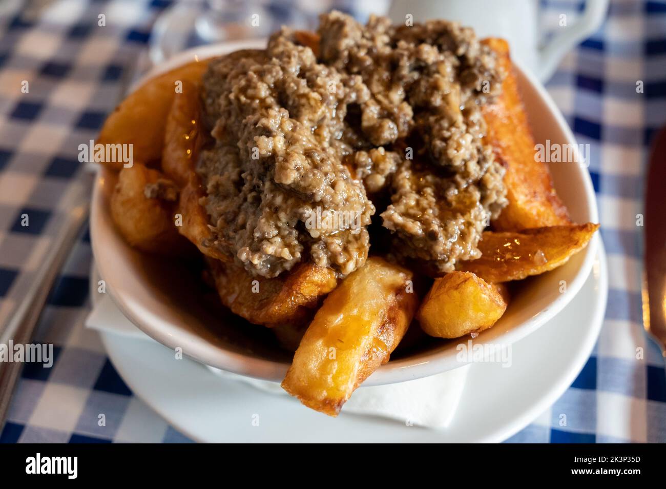 Scottish traditional snack food, hand cut potato chips topped with